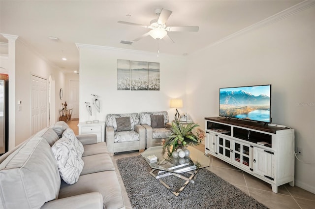 living room with ceiling fan, light tile patterned floors, and ornamental molding