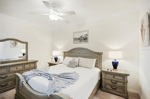 carpeted bedroom featuring ceiling fan and ornamental molding