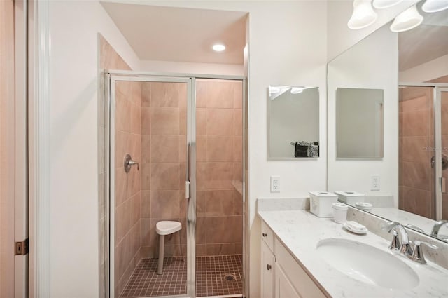 bathroom with vanity and an enclosed shower