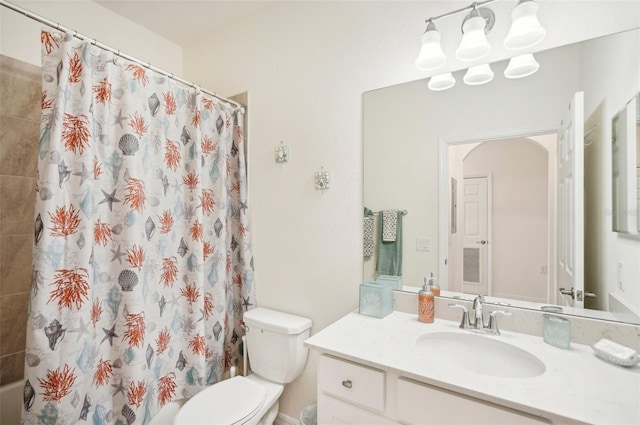 bathroom with vanity and toilet