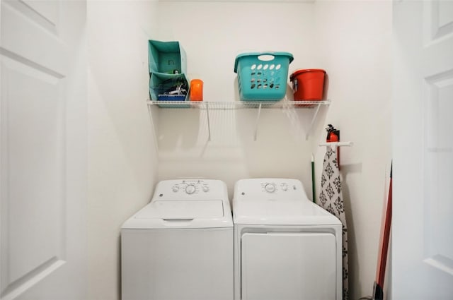 laundry room with independent washer and dryer