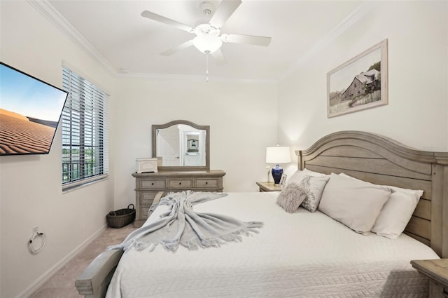 carpeted bedroom featuring ceiling fan and ornamental molding