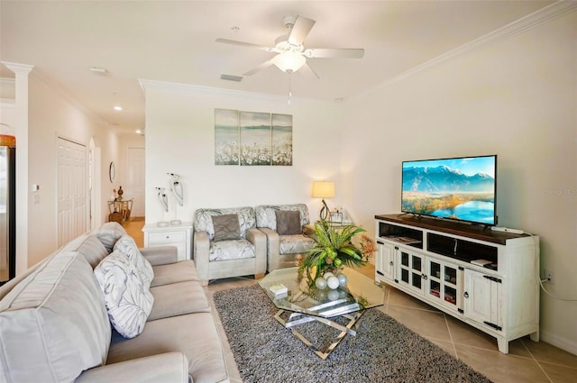 tiled living area with ceiling fan, visible vents, and crown molding