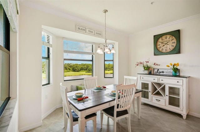 tiled dining room with crown molding, baseboards, and an inviting chandelier