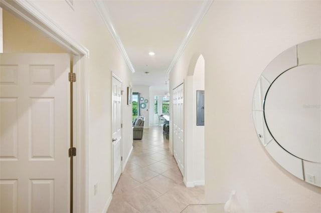 hall featuring light tile patterned flooring, recessed lighting, baseboards, ornamental molding, and washer / dryer