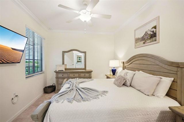 bedroom with baseboards, ceiling fan, carpet flooring, and crown molding