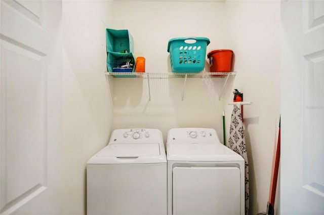 clothes washing area featuring laundry area and washing machine and dryer