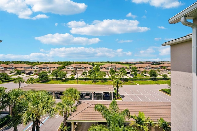 birds eye view of property with a residential view