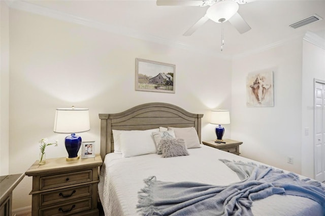 bedroom featuring ceiling fan, visible vents, and ornamental molding