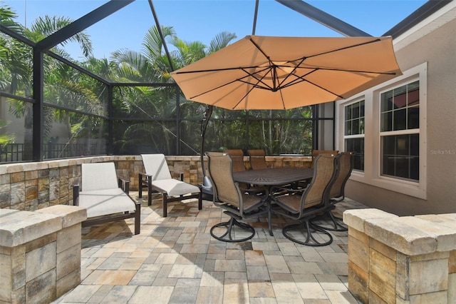 view of patio / terrace featuring a lanai