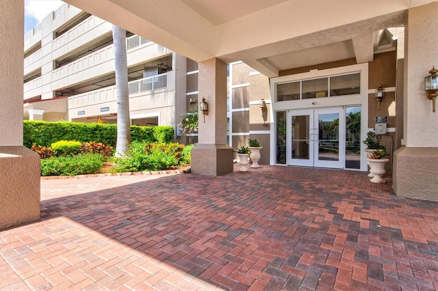 exterior space featuring a balcony and french doors