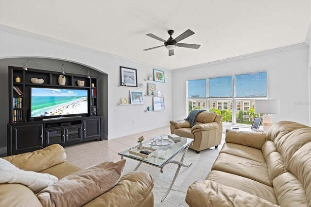 tiled living room featuring crown molding and ceiling fan