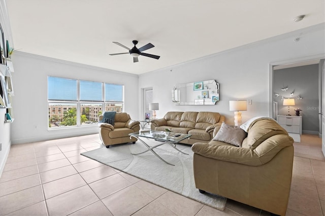 living room featuring crown molding, ceiling fan, and light tile patterned floors