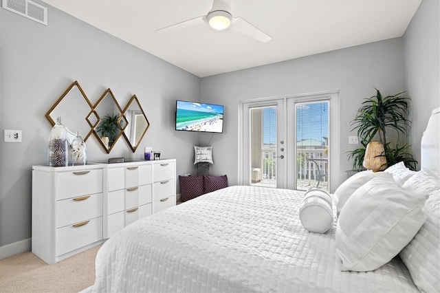 carpeted bedroom with access to outside, french doors, and ceiling fan