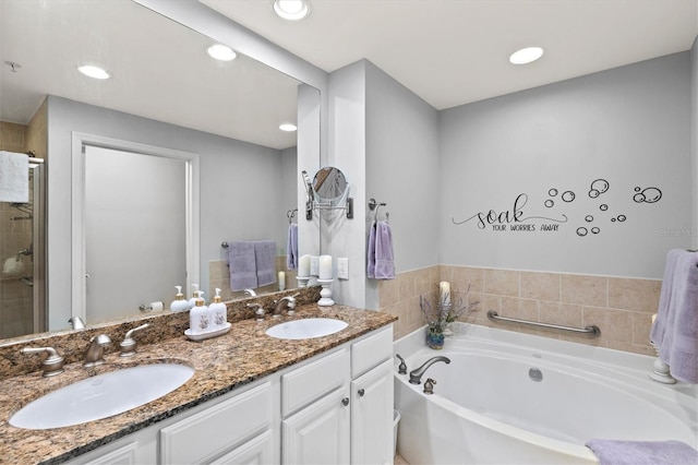 bathroom with vanity and plus walk in shower