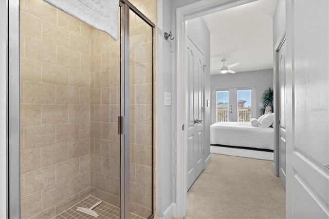 bathroom with french doors, an enclosed shower, and ceiling fan