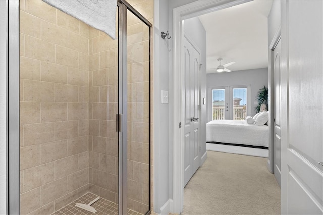 bathroom with walk in shower and ceiling fan