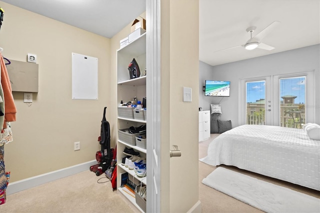 bedroom with access to exterior, french doors, ceiling fan, and light colored carpet