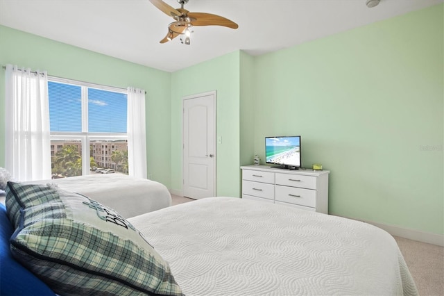 bedroom with ceiling fan and carpet