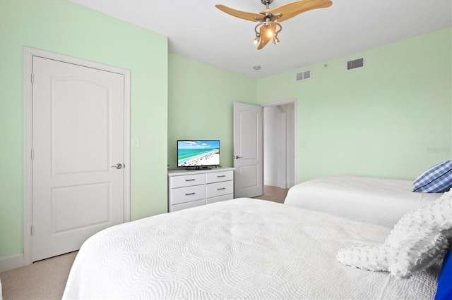 carpeted bedroom featuring ceiling fan