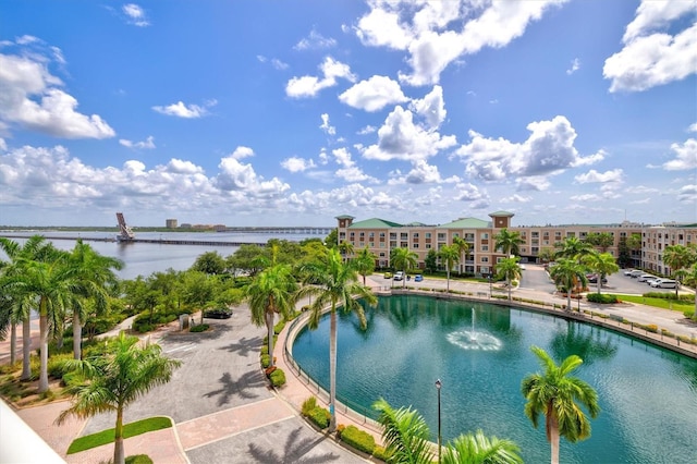 view of swimming pool featuring a water view