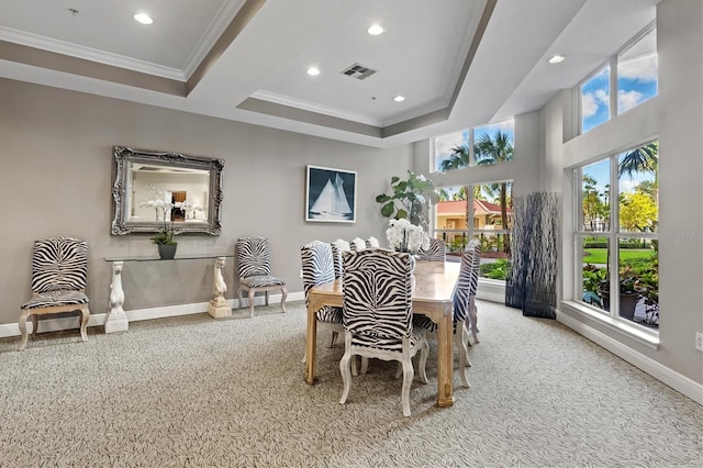 dining space featuring ornamental molding and carpet floors