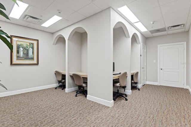 home office featuring a paneled ceiling and light colored carpet