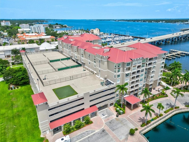 birds eye view of property with a water view