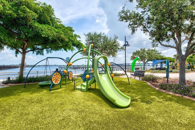 view of jungle gym featuring a water view