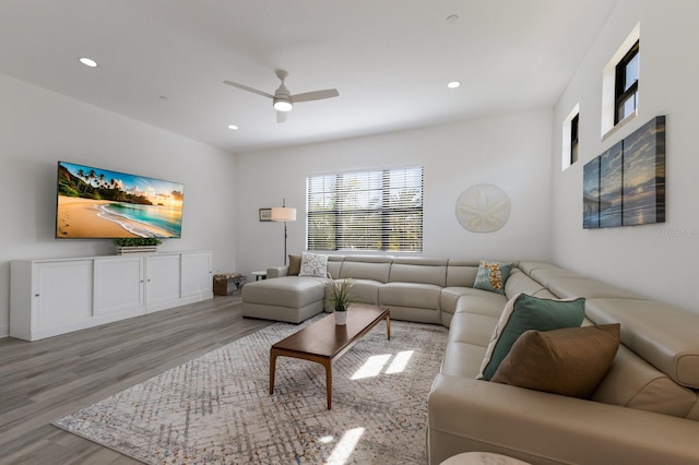 living room with wood finished floors, a ceiling fan, and recessed lighting