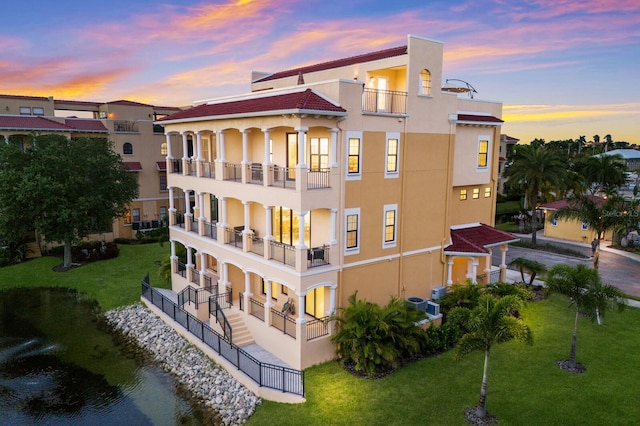 view of outdoor building at dusk