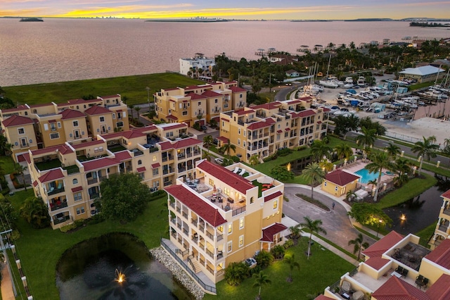 aerial view at dusk with a water view