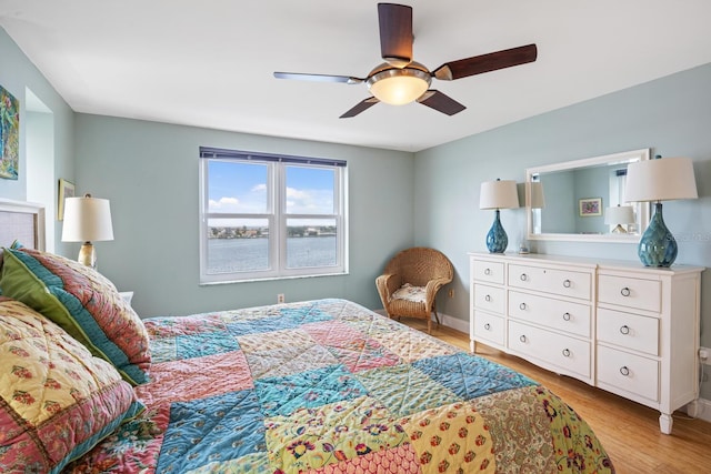 bedroom with ceiling fan and light wood-type flooring