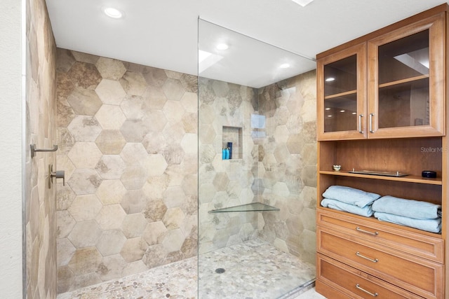 bathroom with a tile shower