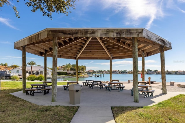 view of community featuring a gazebo, a lawn, and a water view