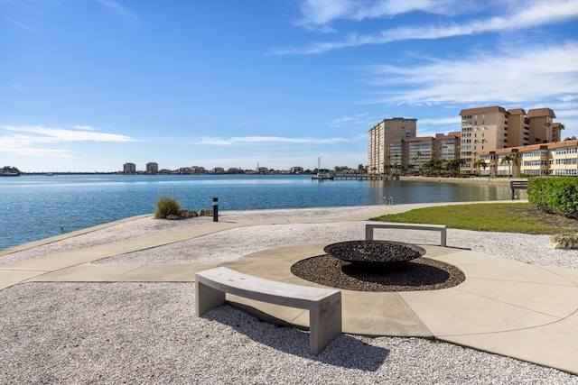 property view of water featuring a fire pit