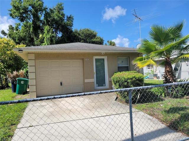707 13th St W, Palmetto, FL 34221 - view of front of home featuring fence, driveway, and stucco siding