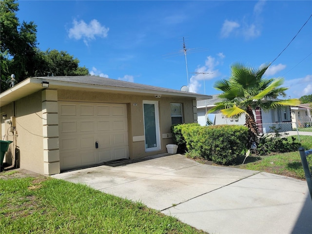 707 13th St W, Palmetto, FL 34221 - view of front of house with stucco siding and concrete driveway
