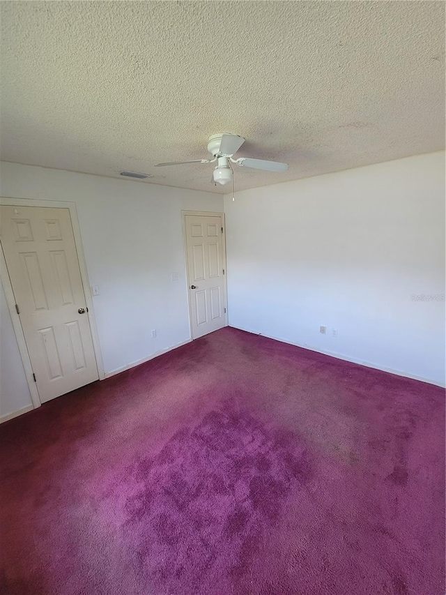 707 13th St W, Palmetto, FL 34221 - unfurnished room featuring visible vents, carpet floors, a textured ceiling, and a ceiling fan