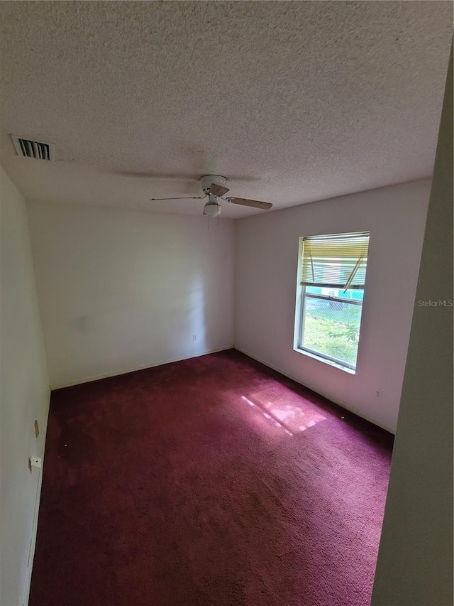707 13th St W, Palmetto, FL 34221 - carpeted spare room featuring a textured ceiling, visible vents, and ceiling fan