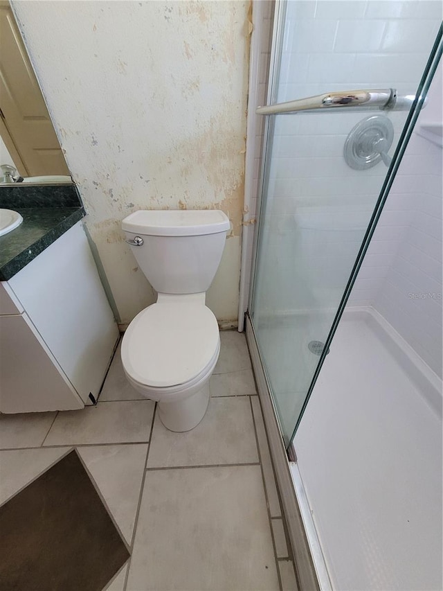 707 13th St W, Palmetto, FL 34221 - full bathroom featuring tile patterned floors, vanity, a shower stall, and toilet