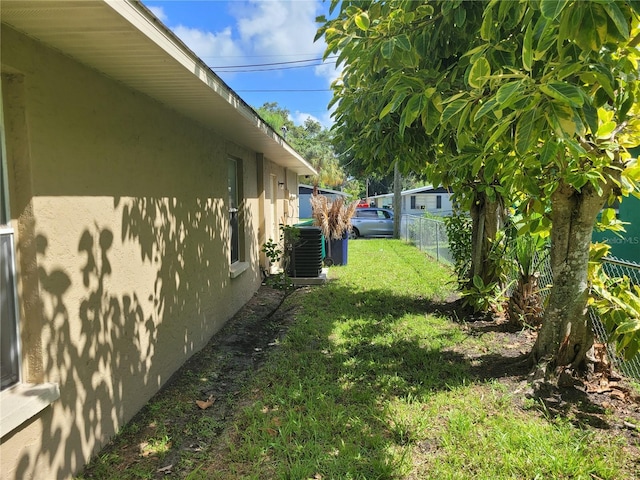 707 13th St W, Palmetto, FL 34221 - view of yard featuring central air condition unit and fence