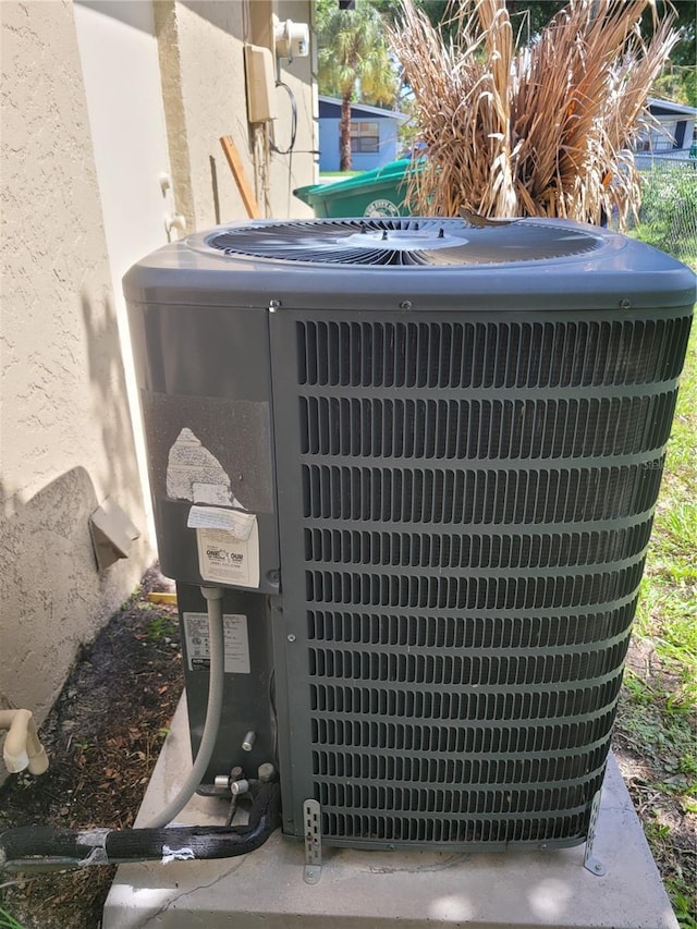 707 13th St W, Palmetto, FL 34221 - details featuring central air condition unit and stucco siding
