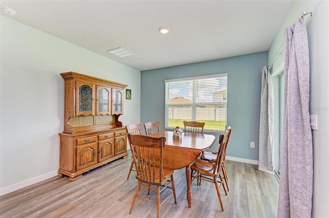 dining area with light wood-type flooring