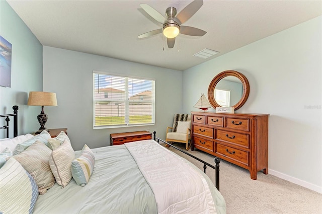 bedroom with light carpet and ceiling fan