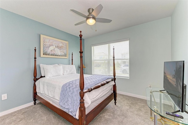 bedroom featuring light carpet and ceiling fan