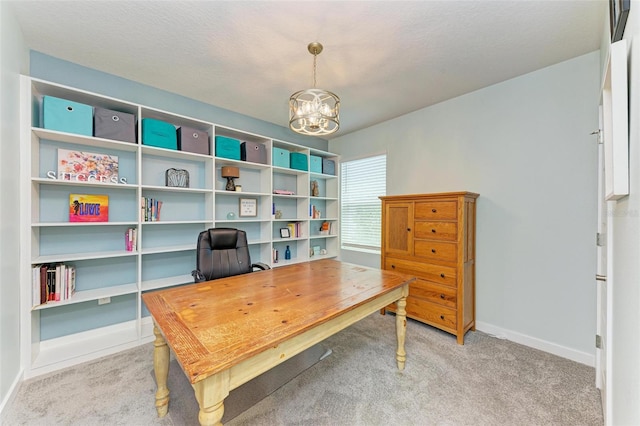 office featuring light colored carpet, a chandelier, and a textured ceiling