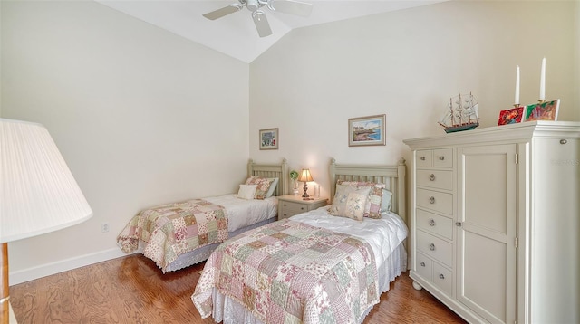 bedroom with wood-type flooring, lofted ceiling, and ceiling fan