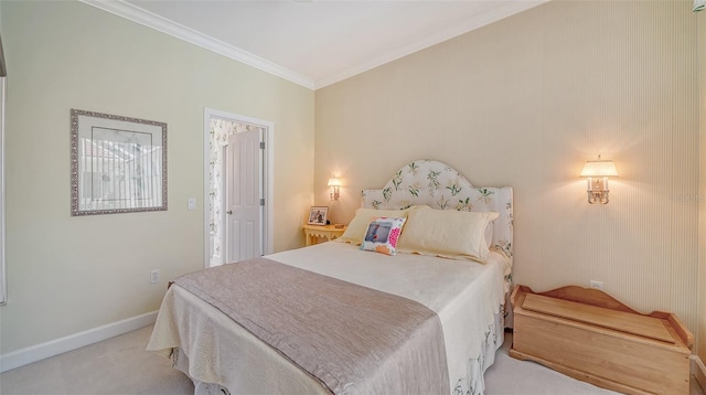 bedroom with ornamental molding and carpet flooring