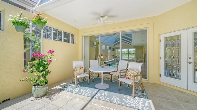 view of patio featuring french doors and ceiling fan